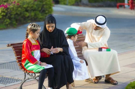 Middle eastern family getting ready for national day|-