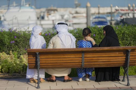 Arab Family sitting on the bench|-