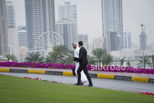Two arab businessmen walking together|-