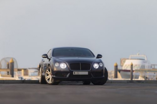 Luxury black colored vehicle parked|-