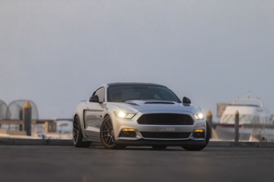 Two arab men inside a parked luxury car|-