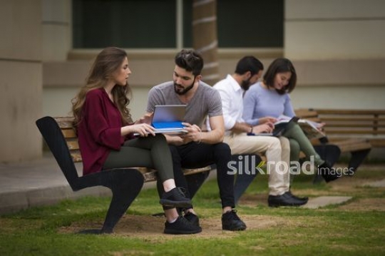 University Students studying together|-