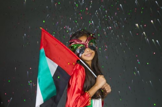 Girl excited celebrating the UAE National Day