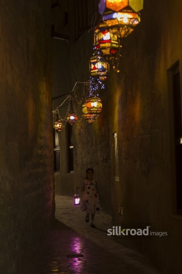 Arab girl carrying a Ramadan Lantern|-