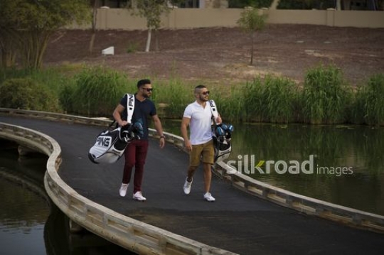 Young men walking together at the Golf Resort|-