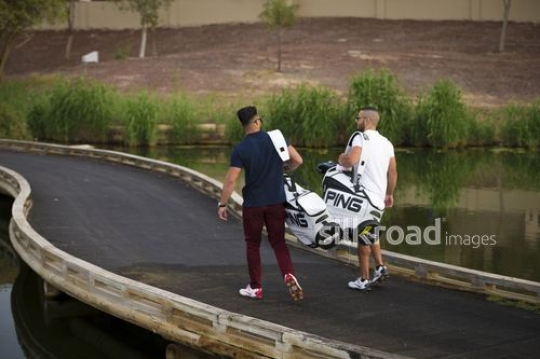 Young Arab men walking together at the Golf Resort|-