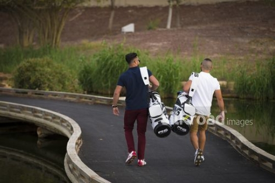 Two friends walking together at the Golf Resort