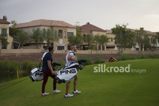 Young Middle Eastern men walking together at the Golf Resort|-