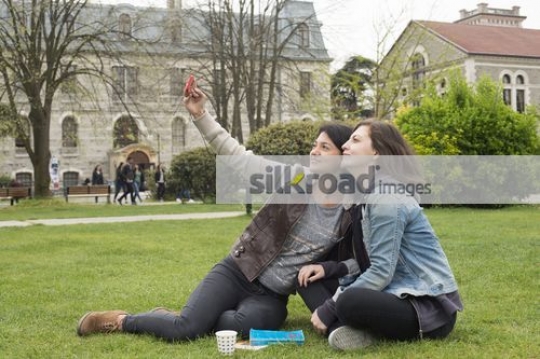 Friends taking a selfie together|
