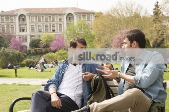 Two Students sitting together chatting
