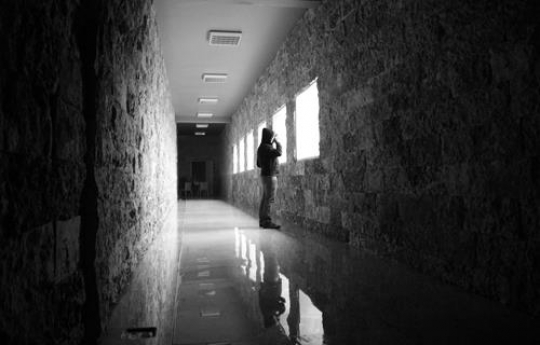 man looking through the window