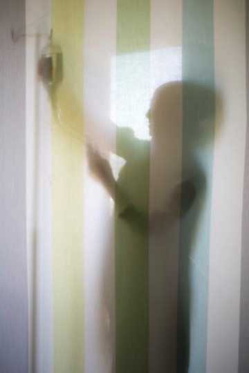 A Woman Doctor Silhouette Hanging Serum on Stand