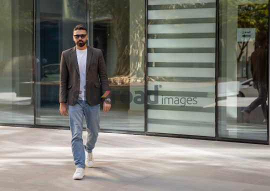 Close-Up of a Professional Man Exiting a Corporate Building