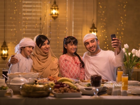 Family taking selfie around iftar|-