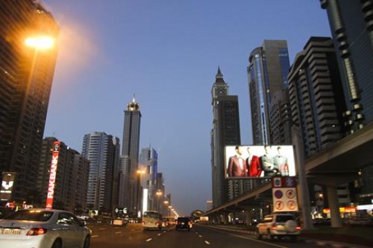 Dubai downtown night scene with city lights, United Arab Emirates architecture