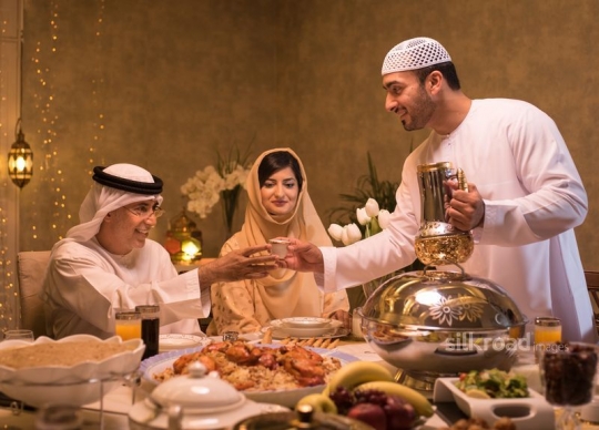 Father serving coffee|