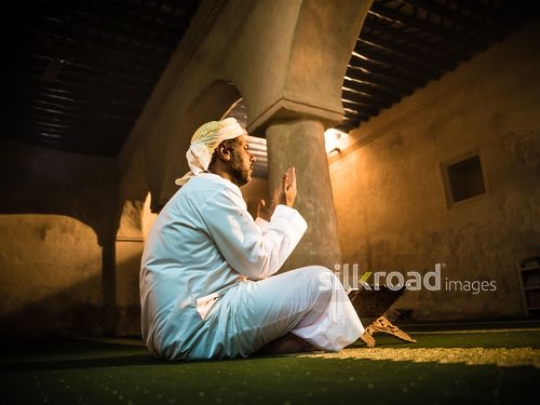 Old man praying at the mosque|-