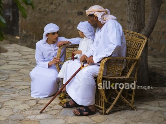 Kids chatting with grandfather|-