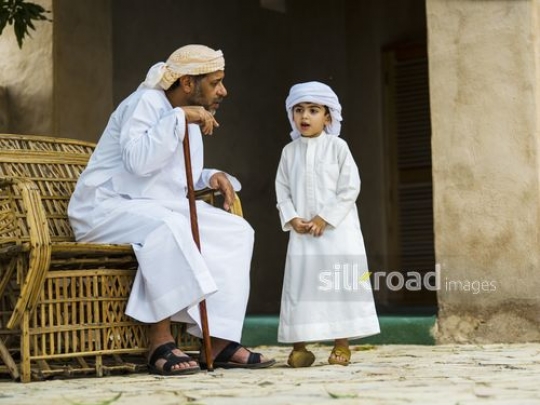 Boy listening to grandfather|-