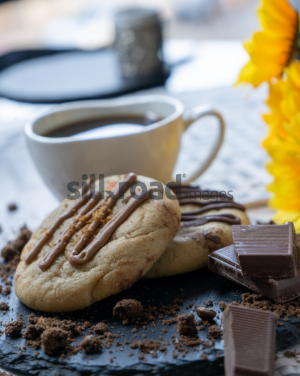 Delicious Cookies with Coffee and Chocolate on Slate Plate