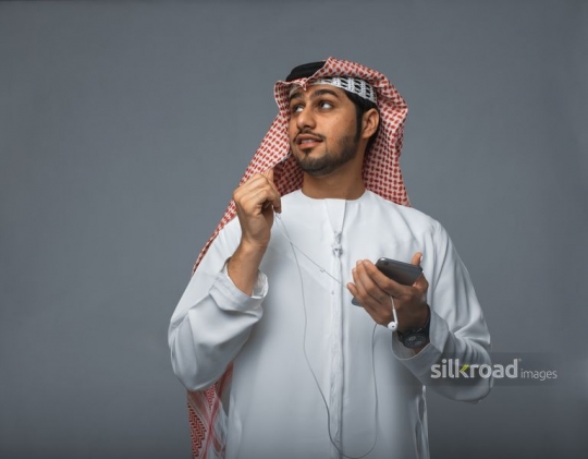 Young Middle Eastern man making a phone call