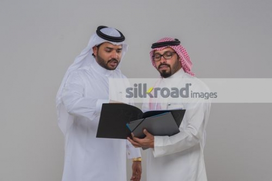 Middle Eastern men talking about business |