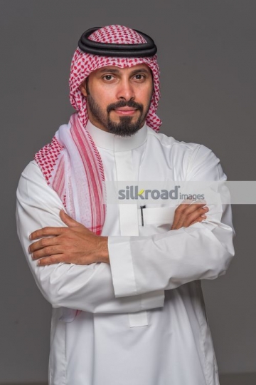 Middle Eastern Businessman arms crossed|