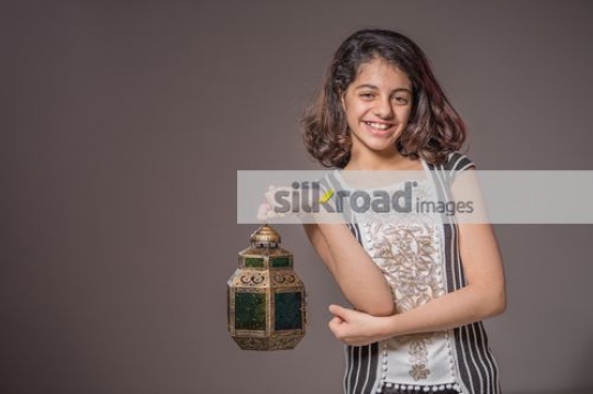 Middle Eastern girl carrying a Ramadan Lantern