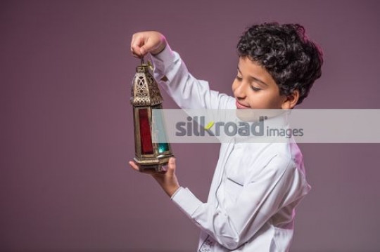 Young Boy carrying the Ramadan Lantern|