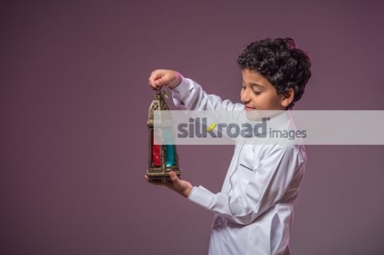 Middle Eastern boy celebrating Eid|
