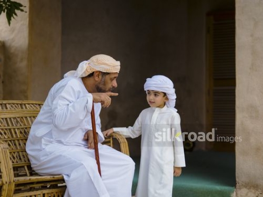 Old man talking to grandson|-