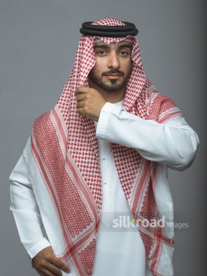 Arabian man fitting his traditional head cover attire