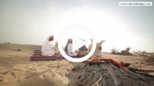 Young men enjoying desert camp