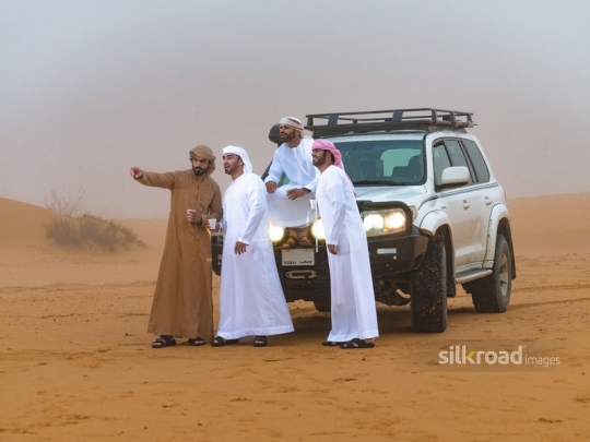 Man pointing to friends