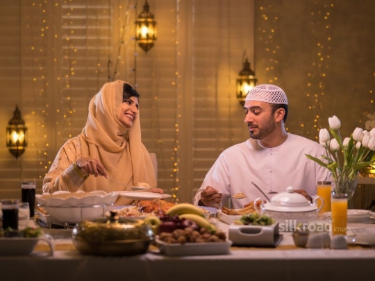 Couple around dining table|-