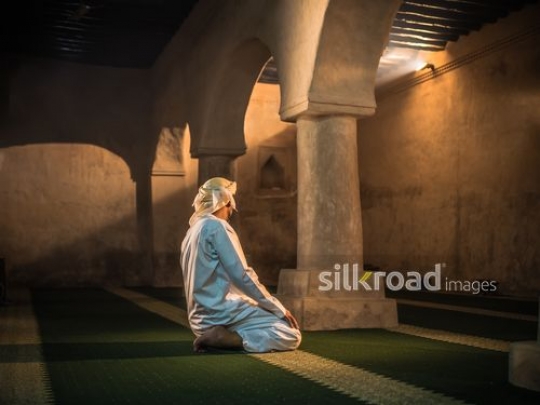 Old man praying inside the mosque|-