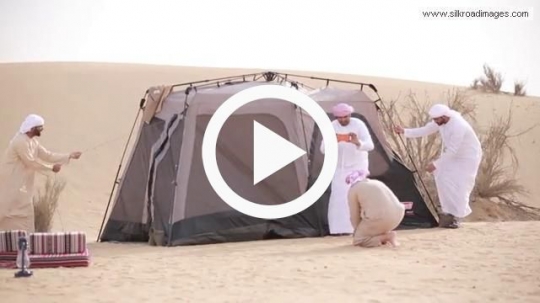 Young men putting up the the tent