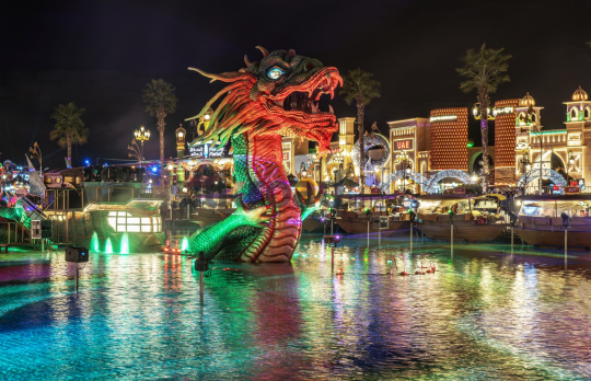 Illuminated Dragon Statue at Dubai Global Village – Night Lights Reflection