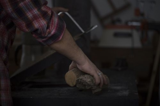 Man grabbing the wood