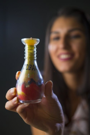 Dubai written on sand art|-