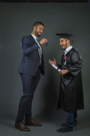 Arab father giving his son a car key