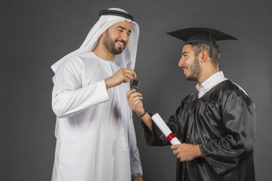 Arab father gifting his son a car on graduation
