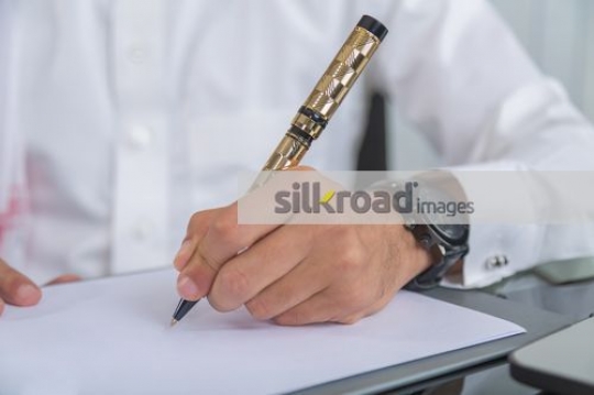 Man writing on the paper