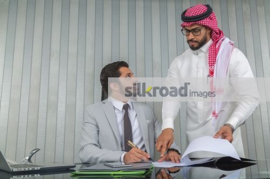 Middle Eastern men having a meeting at the office